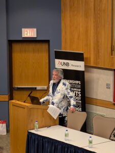 Dual-Use Technologies Summit presenter Speaking in front of the room.