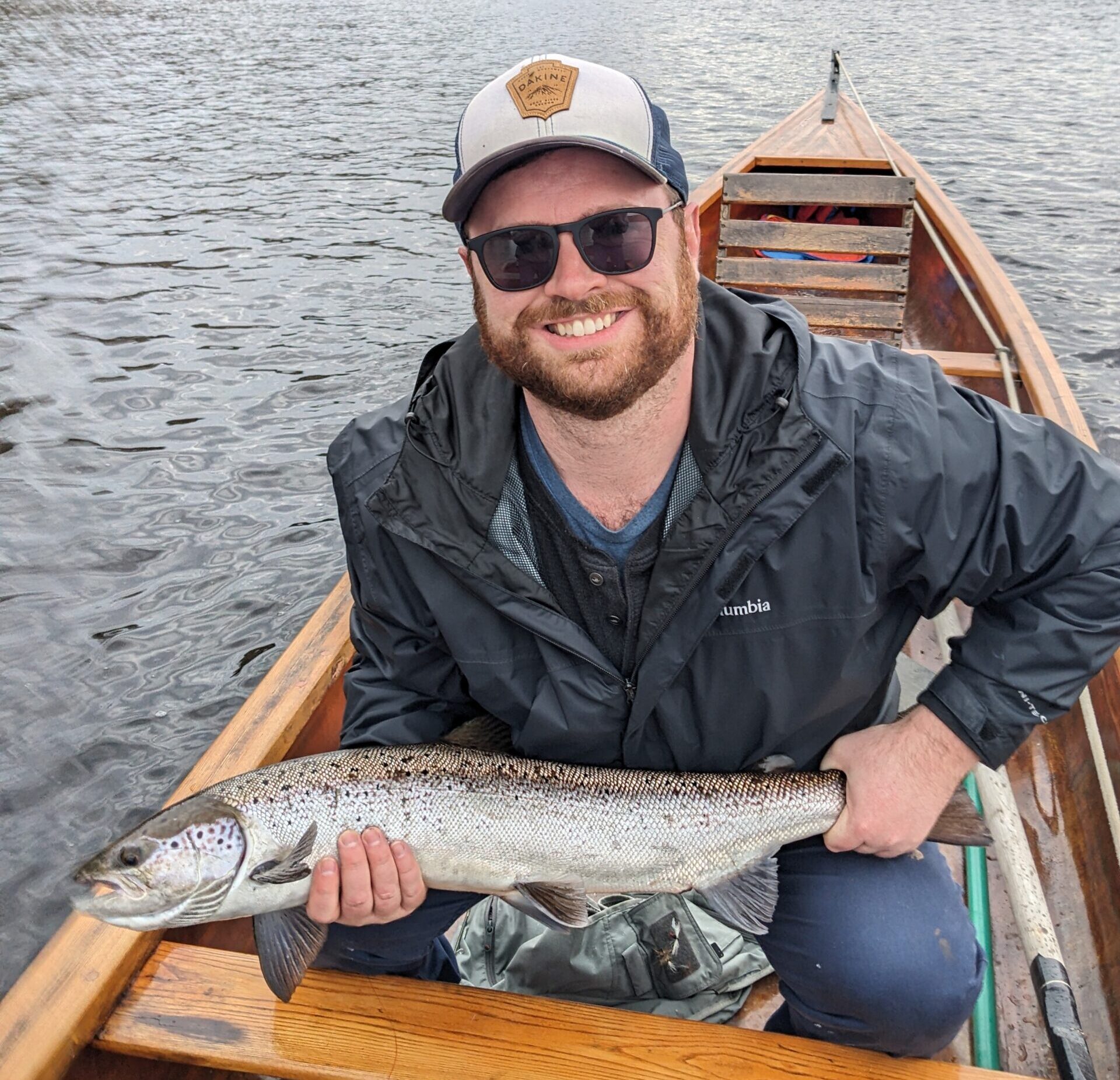 Holding a Miramichi salmon